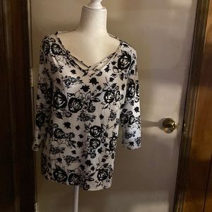Shirt w/ 3.4 length sleeves in bold black print on white of 100% polyester